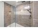 Updated bathroom featuring a tiled shower with glass door and a decorative shower head at 6851 Roswell Rd # I18, Sandy Springs, GA 30328