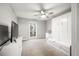 Cozy bedroom featuring a murphy bed, a ceiling fan, and plenty of natural light at 6851 Roswell Rd # I18, Sandy Springs, GA 30328