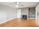 Cozy bedroom with hardwood floors, marble fireplace, and built-in shelving at 6851 Roswell Rd # I18, Sandy Springs, GA 30328
