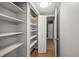 Walk-in closet with built-in shelving, maximizing storage space and organization at 6851 Roswell Rd # I18, Sandy Springs, GA 30328