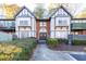 Exterior view of the condo building showing the entrance and landscaping at 6851 Roswell Rd # I18, Sandy Springs, GA 30328