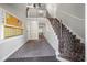 Building hallway featuring carpeted stairs, mailboxes, and dark tile flooring at 6851 Roswell Rd # I18, Sandy Springs, GA 30328