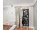 Space-saving laundry area with a stacked washer and dryer hidden behind curtains at 6851 Roswell Rd # I18, Sandy Springs, GA 30328