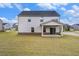 Two-story home with a covered patio and a spacious backyard at 467 Daffodil Ln, Mcdonough, GA 30253