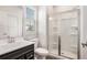Modern bathroom with stand up shower, toilet, and vanity with a contrasting dark cabinet at 467 Daffodil Ln, Mcdonough, GA 30253