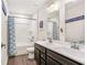 Bathroom featuring a tub/shower combo with double vanity and decorative shower curtain at 467 Daffodil Ln, Mcdonough, GA 30253