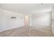 Large bedroom featuring neutral walls and carpet, along with mounted TV bracket at 467 Daffodil Ln, Mcdonough, GA 30253