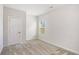 This bedroom features neutral carpet, white trim, and a window to let in plenty of natural light at 467 Daffodil Ln, Mcdonough, GA 30253