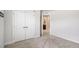 Bright bedroom with a large closet featuring white doors, and neutral carpet at 467 Daffodil Ln, Mcdonough, GA 30253