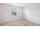 Bright bedroom with a large window provides natural light at 467 Daffodil Ln, Mcdonough, GA 30253