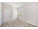 Neutral bedroom with a large window and plush carpeting at 467 Daffodil Ln, Mcdonough, GA 30253