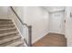 Welcoming entryway with hardwood floors and a staircase leading to the upper level at 467 Daffodil Ln, Mcdonough, GA 30253