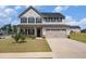 Charming two-story home featuring a two-car garage, covered porch, and well-maintained lawn at 467 Daffodil Ln, Mcdonough, GA 30253