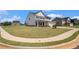 Expansive front yard of a charming two-story home with manicured lawn and inviting curb appeal at 467 Daffodil Ln, Mcdonough, GA 30253