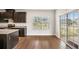 Well-appointed kitchen area with dark cabinets and a sliding glass door leading to the backyard at 467 Daffodil Ln, Mcdonough, GA 30253