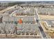 Aerial view of a residential community featuring well-maintained townhomes and landscaped streets at 4145 Essex Pond Way, Cumming, GA 30040