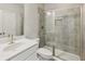 Bathroom featuring a large shower with glass door and a single sink at 4145 Essex Pond Way, Cumming, GA 30040