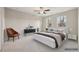 Bedroom featuring a ceiling fan, a large bed, and natural light at 4145 Essex Pond Way, Cumming, GA 30040