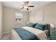 Bedroom featuring a ceiling fan, a large bed, and natural light at 4145 Essex Pond Way, Cumming, GA 30040