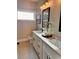 Bright bathroom with double sinks, quartz countertops, and modern fixtures, offering a clean and functional space at 101 Red Oak Ln, Carrollton, GA 30116