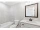 Bathroom with modern fixtures, including a large mirror and sink, plus a tub and shower combination at 101 Red Oak Ln, Carrollton, GA 30116