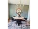 Dining room showcasing a round table, stylish decor, and decorative wall trim with a gold framed mirror at 101 Red Oak Ln, Carrollton, GA 30116