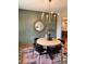 Charming dining room featuring stylish decor, a unique rug, and an elegant light fixture at 101 Red Oak Ln, Carrollton, GA 30116
