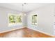 Inviting dining room with hardwood floors and natural light through large windows at 101 Red Oak Ln, Carrollton, GA 30116
