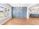 Dining room with large windows, wood floors and detailed wainscoting for an inviting atmosphere at 101 Red Oak Ln, Carrollton, GA 30116