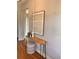 Inviting entryway featuring a rustic console table, modern art, and hardwood floors, creating a warm and stylish welcome at 101 Red Oak Ln, Carrollton, GA 30116