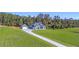 Beautiful home features a detached garage, long driveway, and expansive lawn area at 101 Red Oak Ln, Carrollton, GA 30116