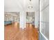 Welcoming foyer with wood floors, leading to an open-concept living area with modern lighting and natural light at 101 Red Oak Ln, Carrollton, GA 30116