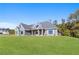 Charming home featuring a well-manicured lawn and a welcoming front porch with columns at 101 Red Oak Ln, Carrollton, GA 30116