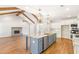 Open concept kitchen with a large island, stainless steel appliances, and living room views at 101 Red Oak Ln, Carrollton, GA 30116