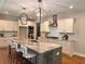 Bright kitchen with a large island, stainless steel appliances, and ample storage at 101 Red Oak Ln, Carrollton, GA 30116