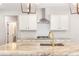 Modern kitchen with stainless steel appliances, a marble island, and white cabinetry for a sleek, functional design at 101 Red Oak Ln, Carrollton, GA 30116