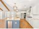 Modern kitchen with white cabinets, granite counters, a large island, and modern lighting fixtures at 101 Red Oak Ln, Carrollton, GA 30116