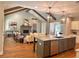 Open-concept living space with a kitchen island, fireplace, and modern decor at 101 Red Oak Ln, Carrollton, GA 30116