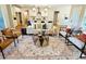 Bright living room featuring an open floor plan and stylish furniture with view into the kitchen and island at 101 Red Oak Ln, Carrollton, GA 30116