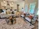 Bright living room featuring an open floor plan and stylish furniture with view into the kitchen and island at 101 Red Oak Ln, Carrollton, GA 30116
