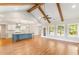 Open layout with wood beams and vaulted ceilings leading into kitchen with large island at 101 Red Oak Ln, Carrollton, GA 30116