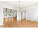Spacious living area featuring wood floors, a ceiling fan, and bright windows offering scenic views at 101 Red Oak Ln, Carrollton, GA 30116