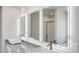 Modern bathroom with three lighted mirrors, vessel sinks, granite countertops and a tiled shower at 620 Egrets Landing Lot #68 Lndg, Covington, GA 30014