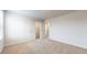 Neutral bedroom with plush carpeting and a closet featuring double doors, offering ample storage at 620 Egrets Landing Lot #68 Lndg, Covington, GA 30014