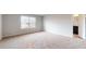 Spacious bedroom with carpet flooring and a window to let in natural light and an attached bathroom at 620 Egrets Landing Lot #68 Lndg, Covington, GA 30014