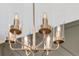 Close-up of a modern chandelier with glass shades and brass finish at 620 Egrets Landing Lot #68 Lndg, Covington, GA 30014