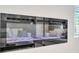 Modern electric fireplace with a sleek black frame and decorative logs providing a warm glow at 620 Egrets Landing Lot #68 Lndg, Covington, GA 30014