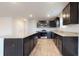 Kitchen with granite counters, stainless steel appliances, and dark cabinets at 620 Egrets Landing Lot #68 Lndg, Covington, GA 30014