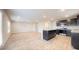Open-concept kitchen with island, stainless steel appliances, and wood flooring at 620 Egrets Landing Lot #68 Lndg, Covington, GA 30014