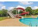 Fun community waterslide flowing into the pool, perfect for Gathering enjoyment at 620 Egrets Landing Lot #68 Lndg, Covington, GA 30014